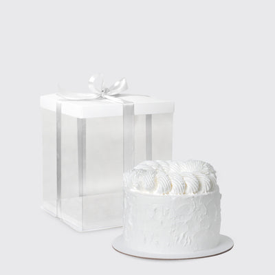 Delicious white frosted cake with decorative piping from the Pure Serenity Set