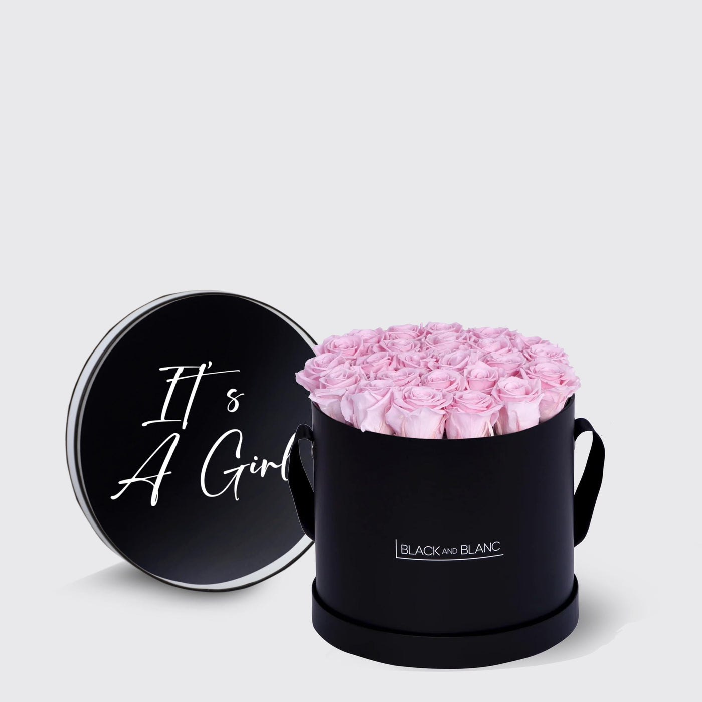 Black cylindrical box with pink roses and It’s A Girl lid from Infinity Texte de Fleur