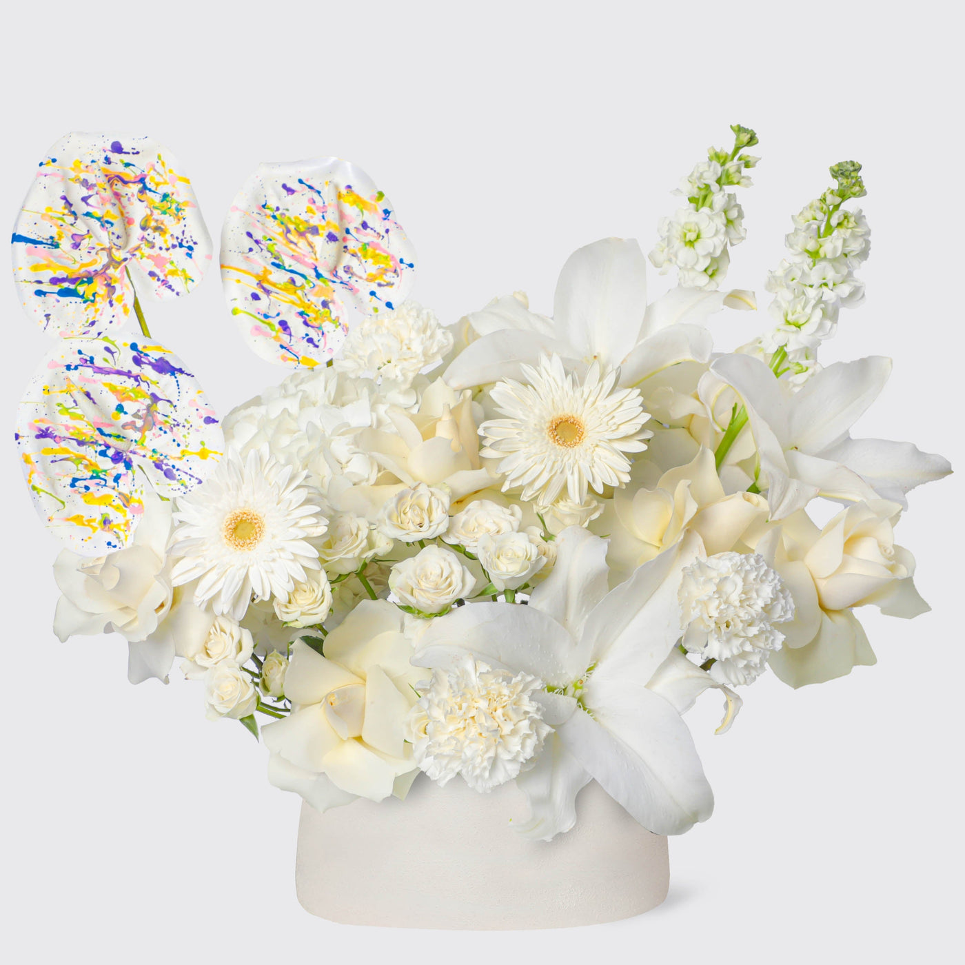 Floral arrangement of white flowers in round container for Ivory Elegance in Vase