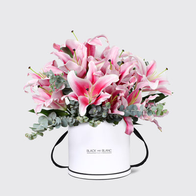 Bouquet of pink lilies in a white container for Lily Pink in Box Fresh Flowers