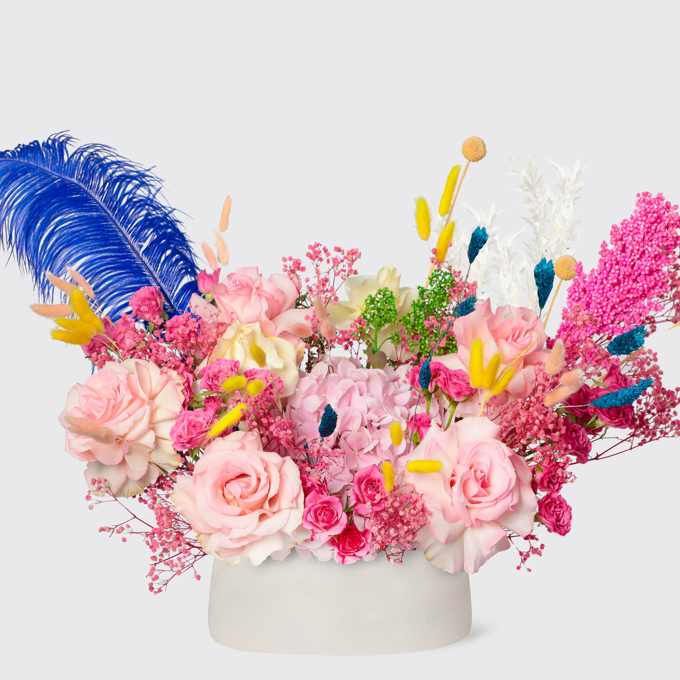 Vibrant floral arrangement in a white vase with roses and colorful blooms, Prismatic Delight