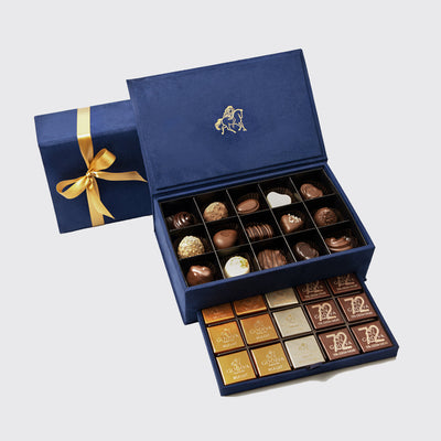 Elegant royal gift box small with assorted chocolates and a gold ribbon-tied lid