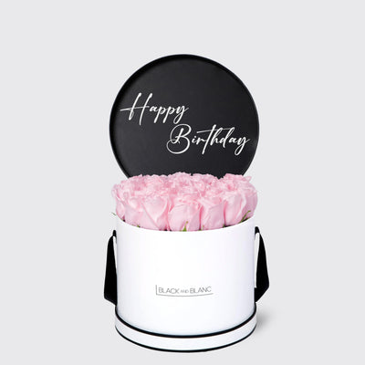 Elegant white box of pink roses with black Happy Birthday sign by Texte De Fleur