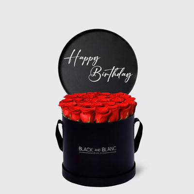 Circular black box with red roses and a Happy Birthday message from Texte De Fleur