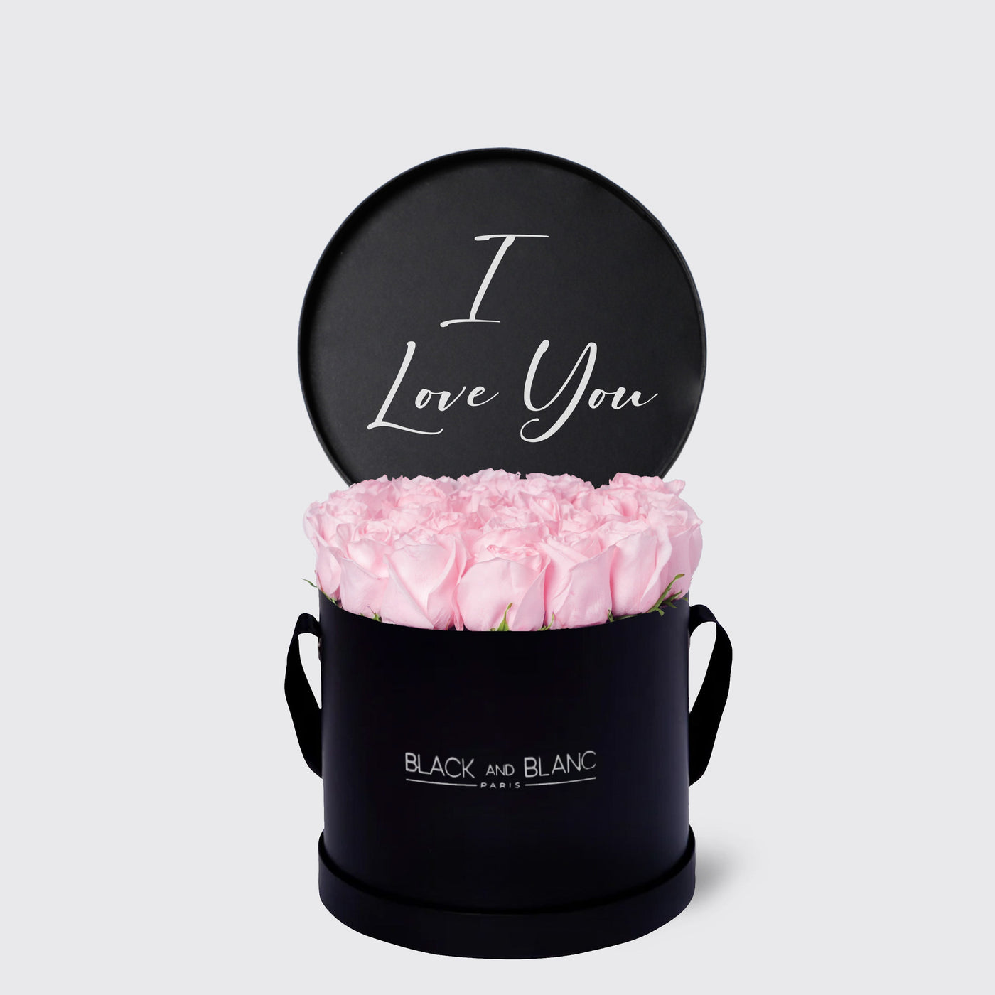 Elegant black floral box with pink roses and a cute I Love You sign from Texte De Fleur