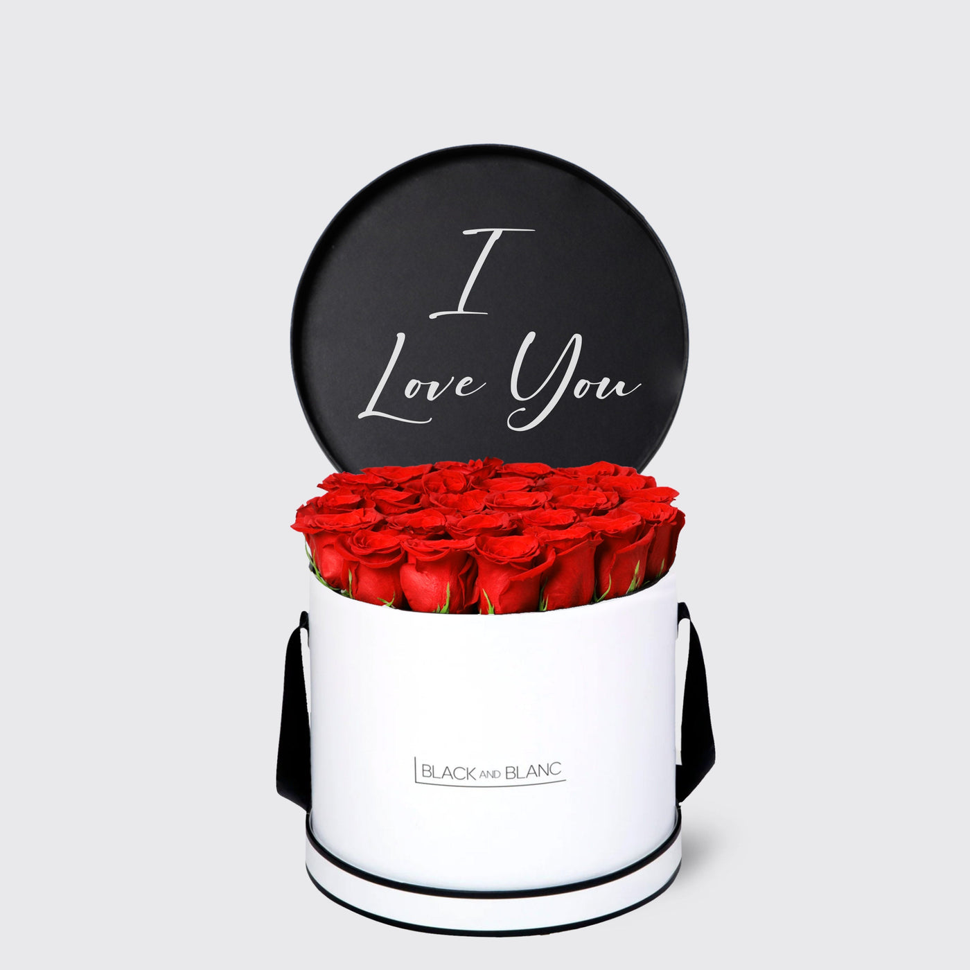 Cylindrical white box with red roses and black lid saying I Love You from Texte De Fleur