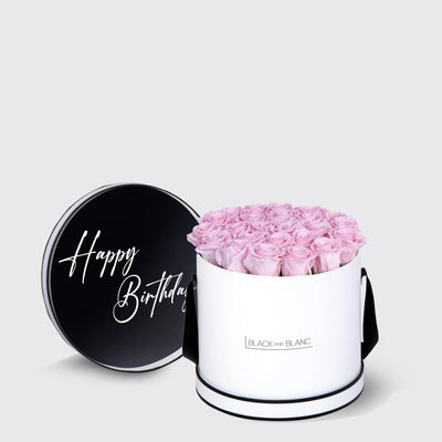 Elegant white box with pink infinity roses and a black lid saying Happy Birthday