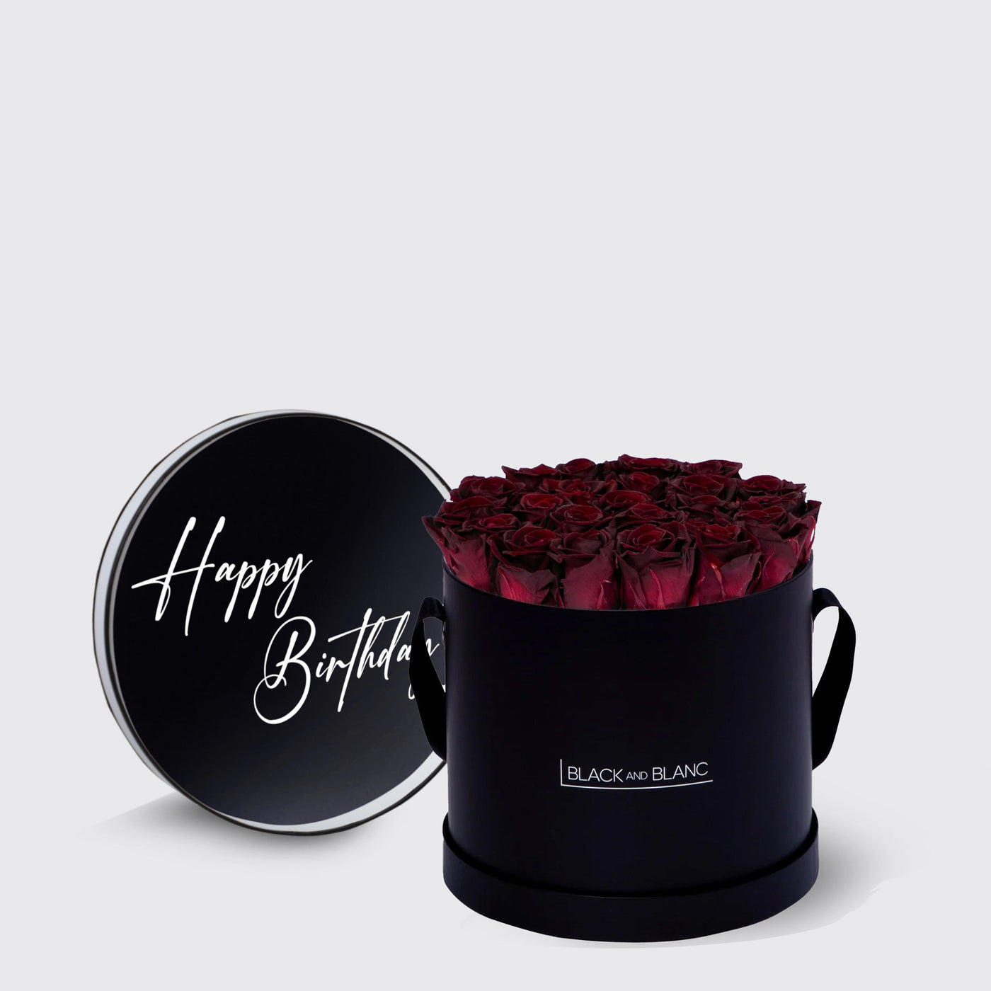 Elegant black round box of infinity roses with Happy Birthday lid design