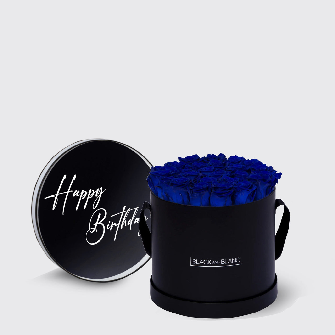 Circular black box of vibrant blue infinity roses with a Happy Birthday lid