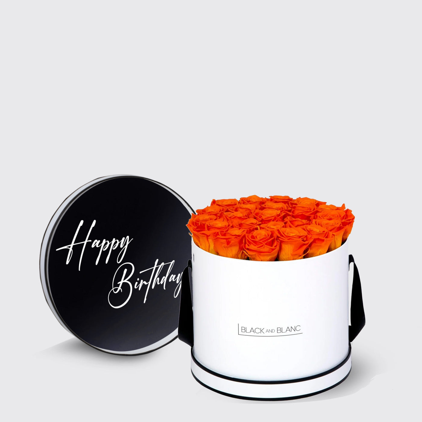 Cylindrical white box with infinity roses, vibrant orange roses, and Happy Birthday lid