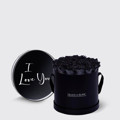 Circular black box of infinity roses with a lid that says I Love You