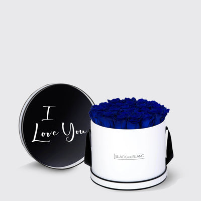 Cylindrical white box with vibrant blue infinity roses and a lid saying I Love You