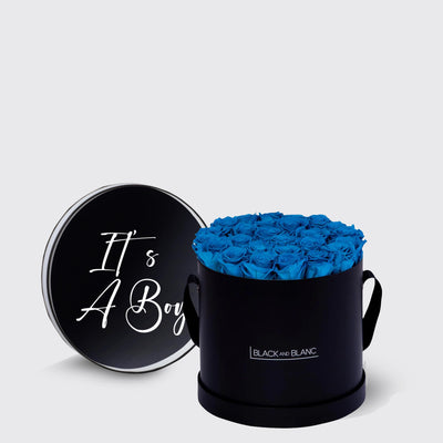 Circular black box with blue infinity roses and It’s A Boy lid in white script