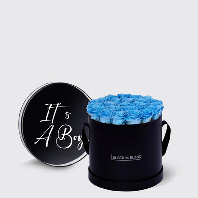 Circular black box of bright blue infinity roses with It’s A Boy lid design