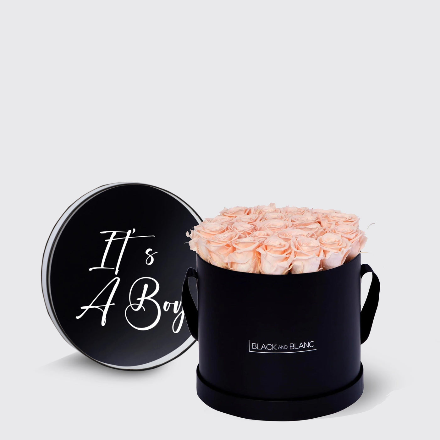 Circular black box with light pink infinity roses and It’s A Boy lid design