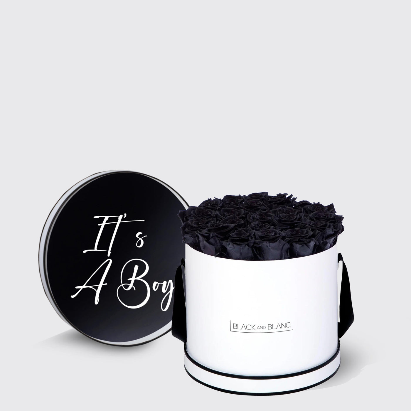 Cylindrical white box with black roses and It’s A Boy text, perfect for infinity roses lovers