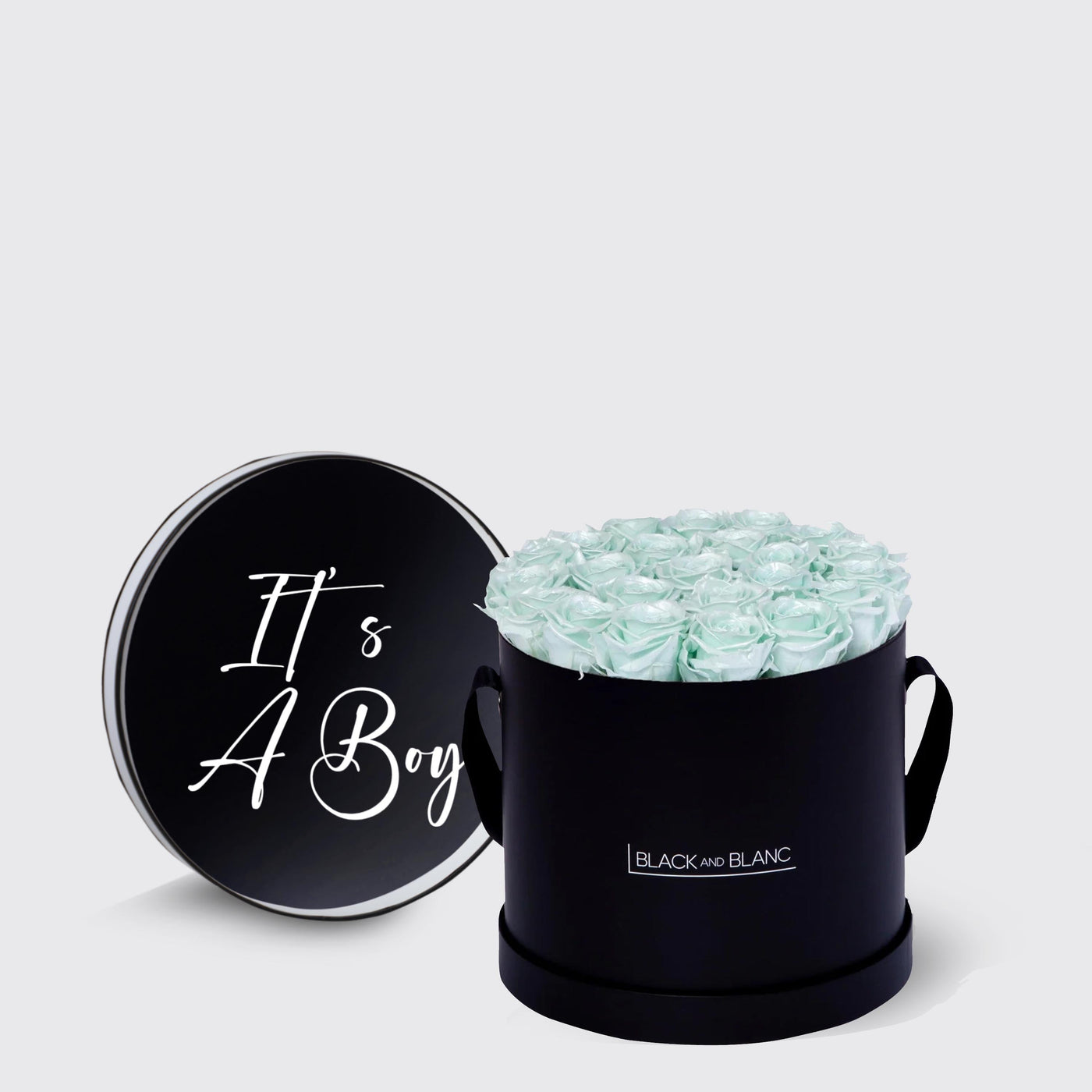 Cylindrical black box with pale blue infinity roses and lid saying Its A Boy