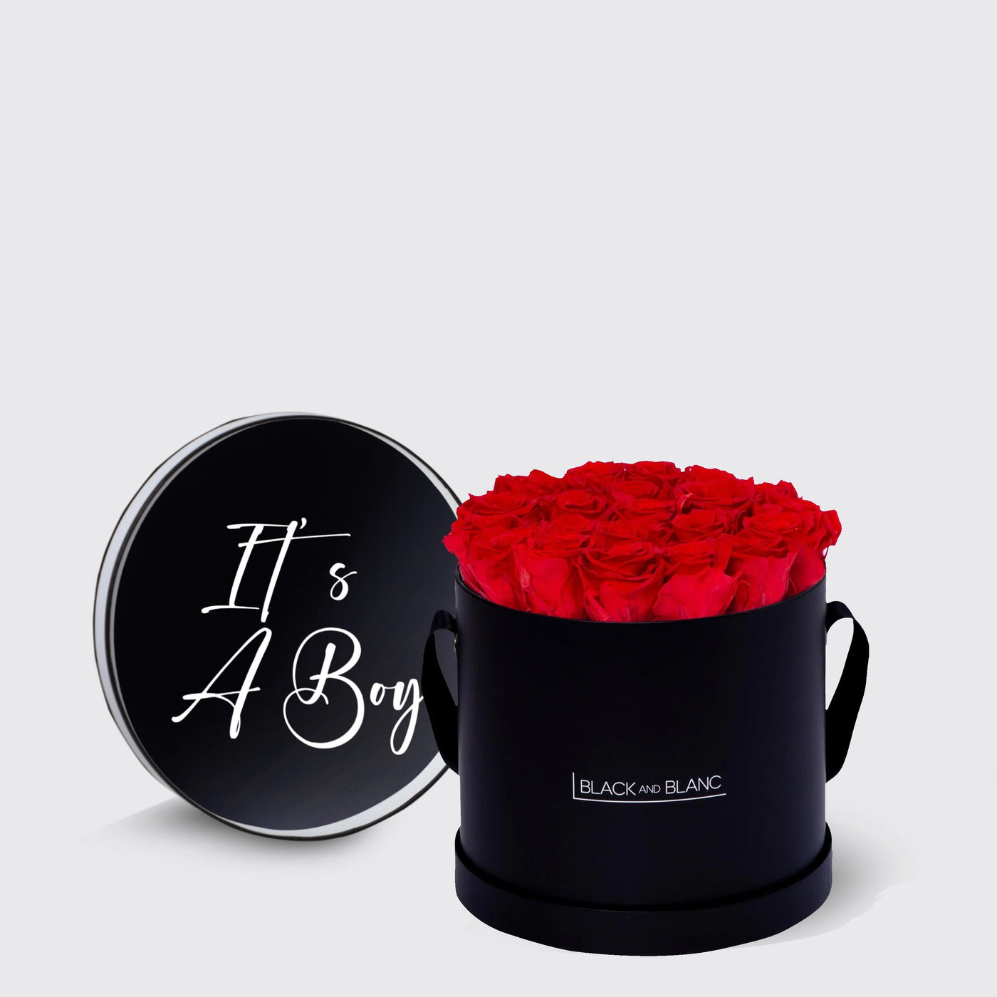 Black box with vibrant red Infinity Roses and a lid marked It’s A Boy