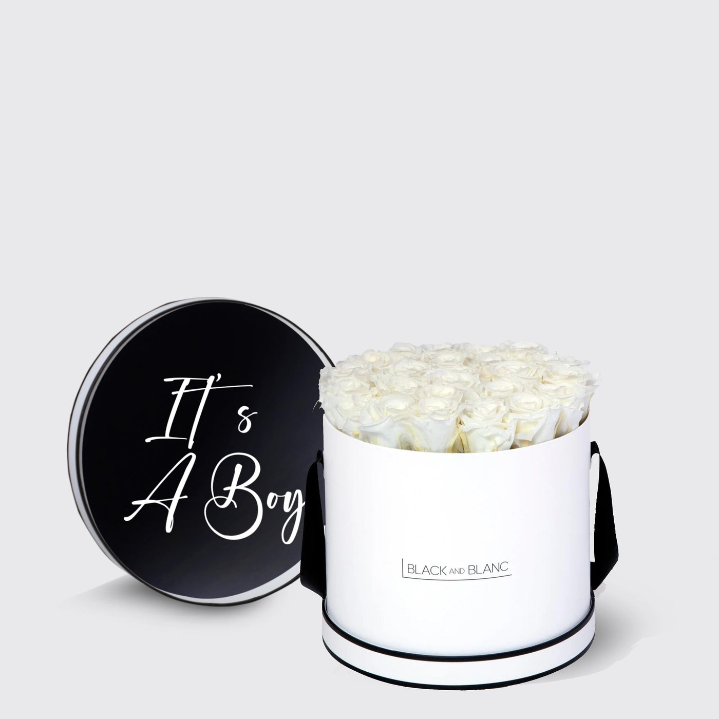 Cylindrical white box with black lid and roses, perfect for It’s A Boy celebration with infinity roses