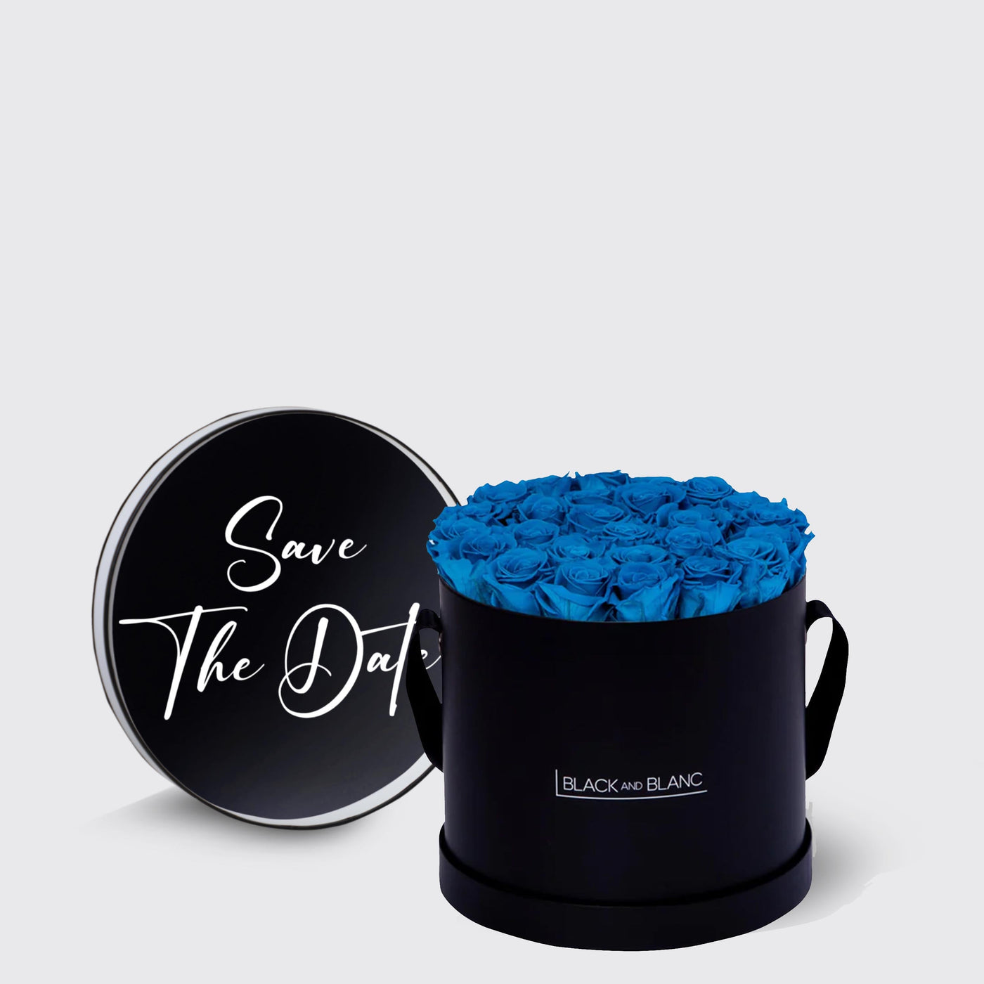 Circular black box of vibrant blue infinity roses with Save The Date lid