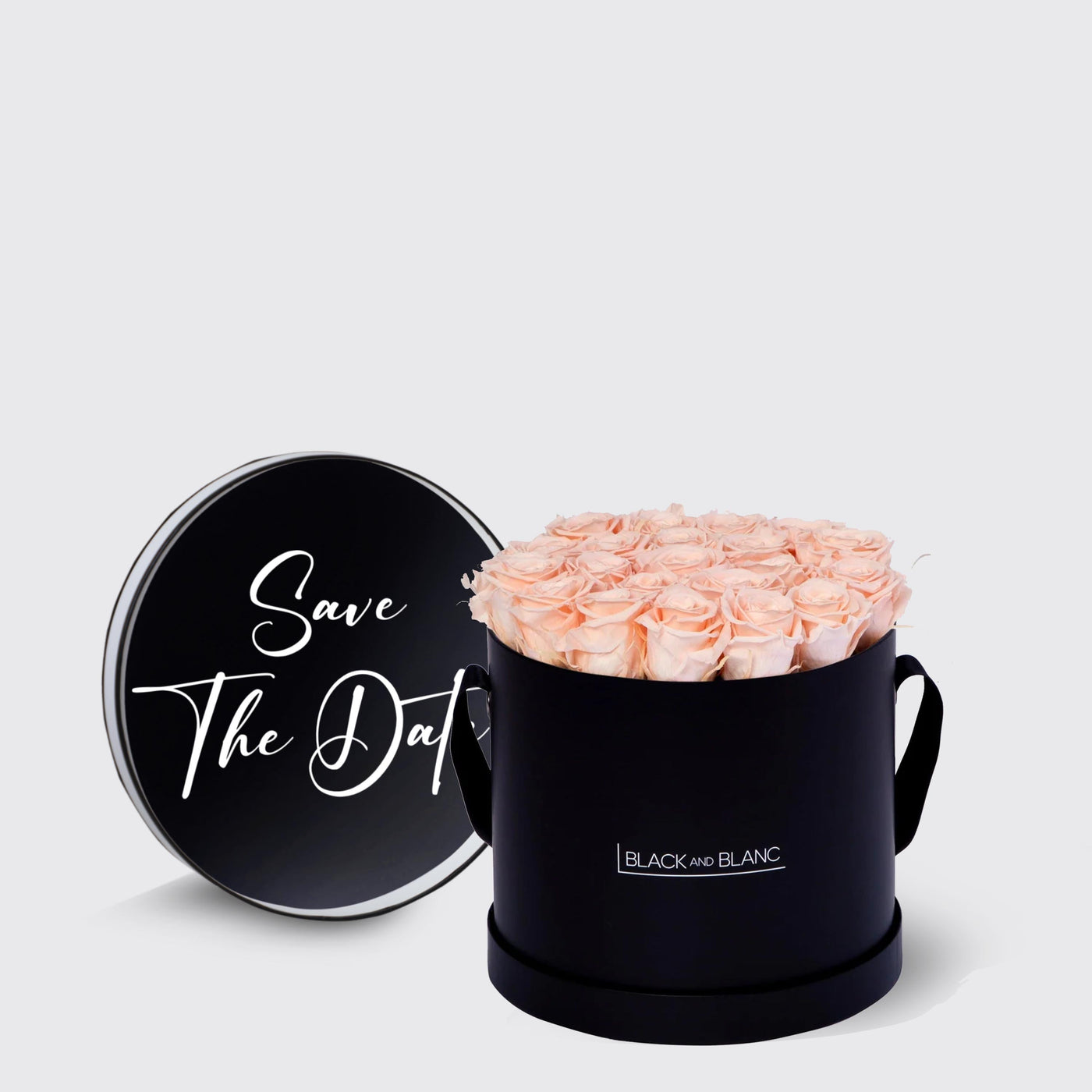 Circular black box of light pink infinity roses showing Save The Date for special events