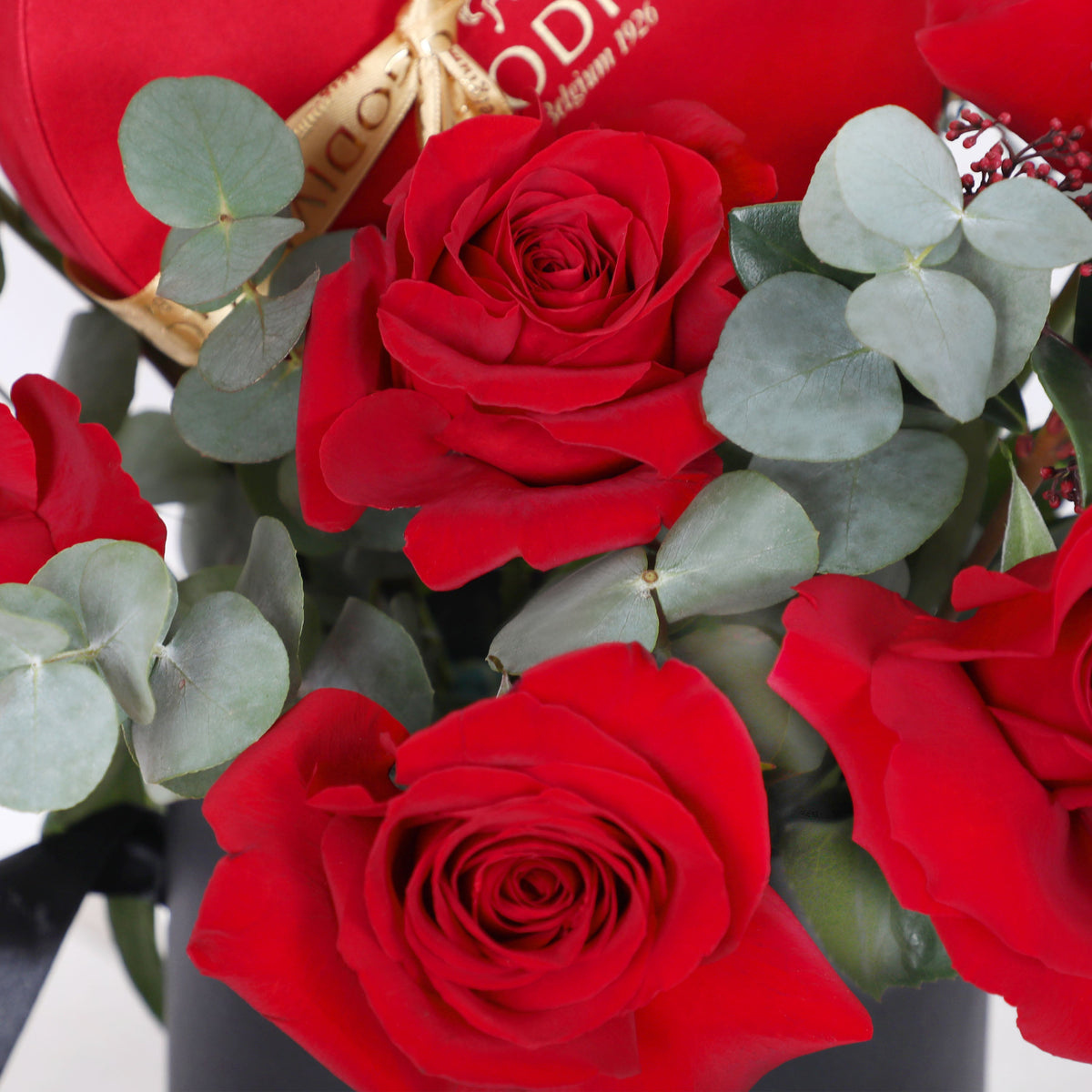 Vibrant red roses with eucalyptus in the Velvet Heart Assortment